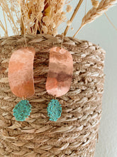 Load image into Gallery viewer, Hammered copper medallion with a turquoise-colored bead woven coin.
